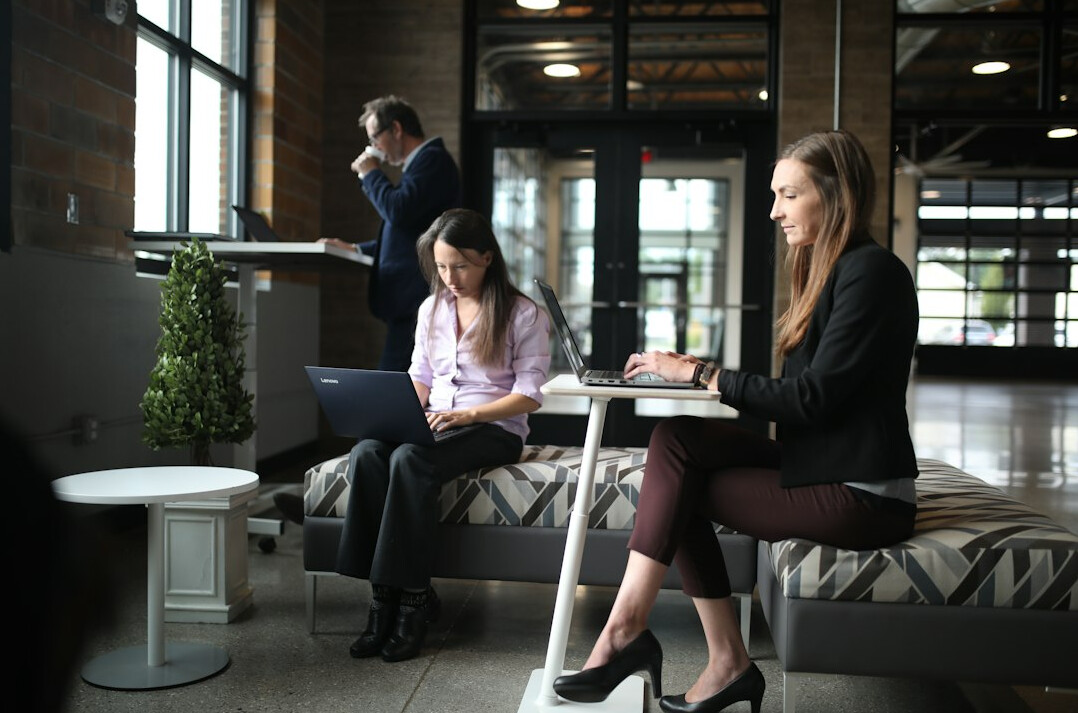 employees working at ergonomic desks